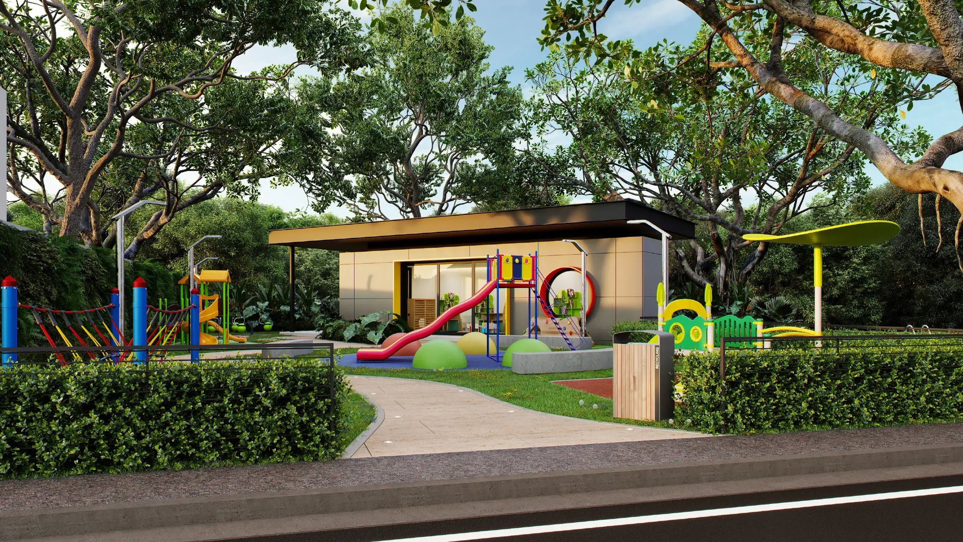 Render de parque infantil y ludoteca de Eurohogar. Muestra juegos de colores con toboganes, áreas de escalada y senderos peatonales rodeados de árboles. Al fondo, un edificio moderno destinado a juegos bajo techo para niños.