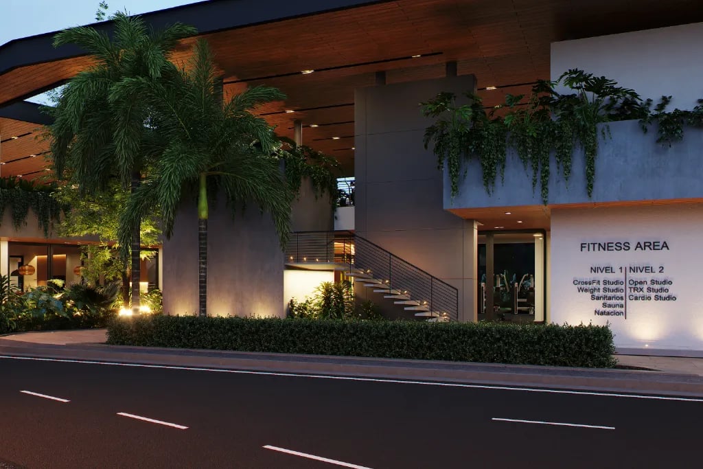 Render de la fachada moderna del área de fitness iluminada de noche. Muestra un directorio en la pared que detalla amenidades: Nivel 1 con CrossFit, Pesas, Sanitarios, Sauna y Natación; y Nivel 2 con Open Studio, TRX y Cardio.