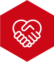 Icono de línea blanca que muestra dos manos entrelazadas formando un corazón, simbolizando cuidado, empatía y compromiso comunitario, dentro de un hexágono de fondo rojo sólido.